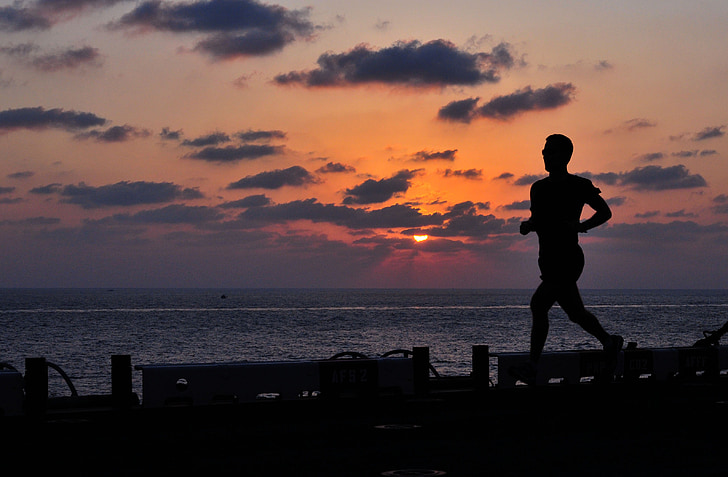 silhouette photo of man while running