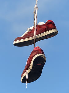 photography of pair of red sneakers