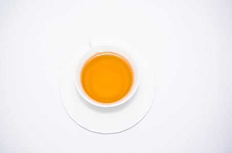 white cup with tea