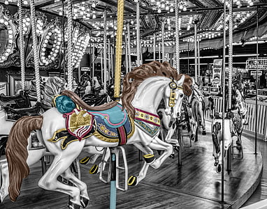 selective color photo of carousel horse