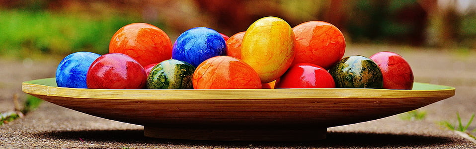 assorted-color decorative eggs on tray