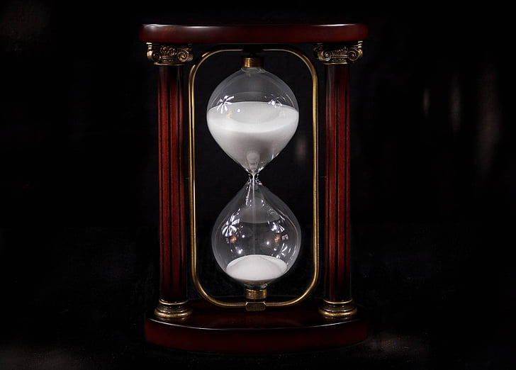 photo of brown and clear hourglass