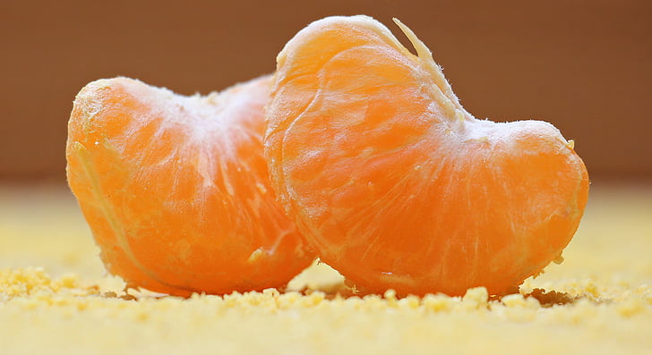 focused photo of two slices of oranges