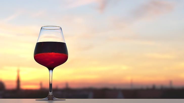 focused photography of red wine in wine glass