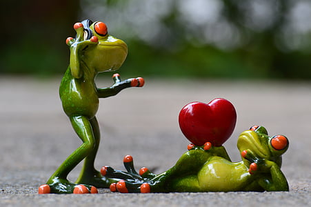 male and female frog figurine