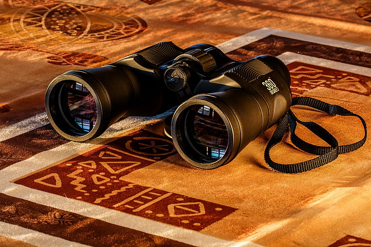 black binoculars on mat