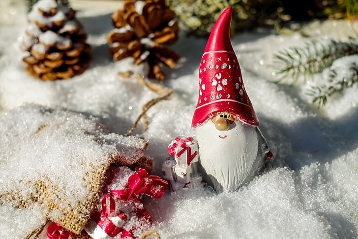 gnome Santa figurine on snow ground