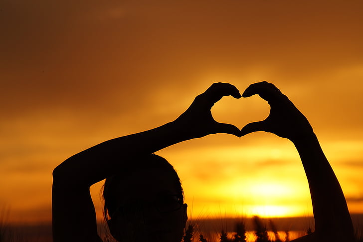 silhouette of heart sign during sunset