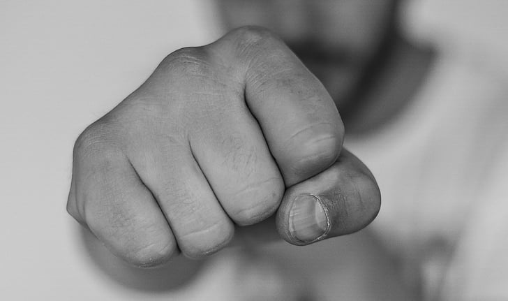 close up photograph of person hand fist