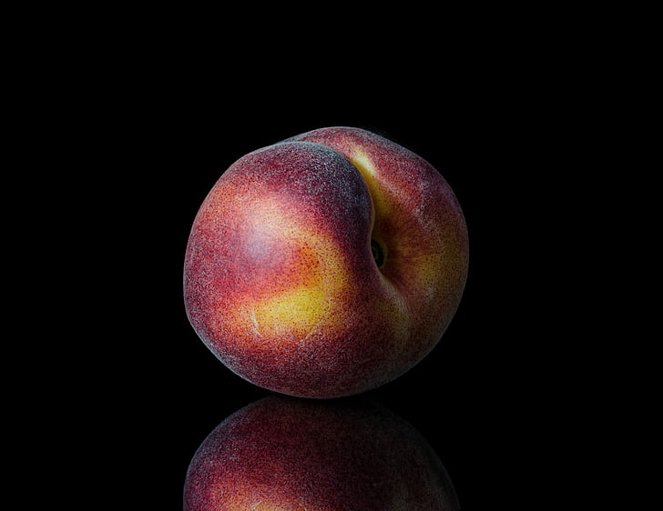 crisp apple on black surface