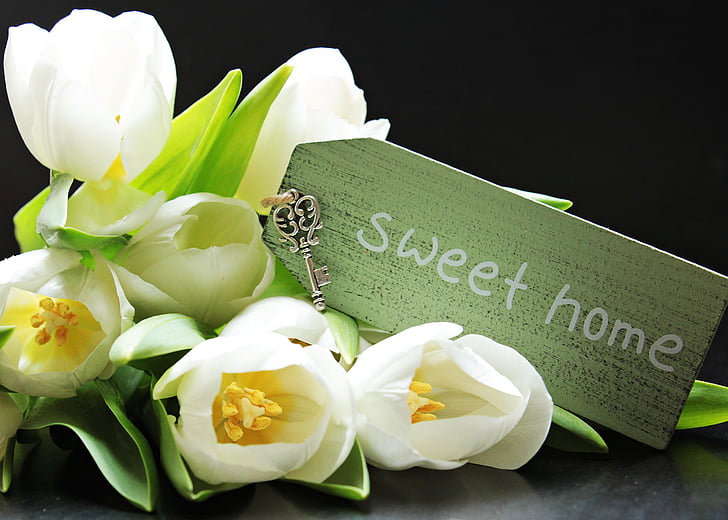 white tulips with sweet hone card labeled bouquet