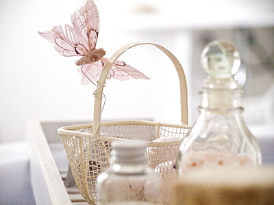 beige basket with butterfly accent