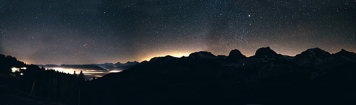 panorama photo of mountain with trees during nighttime