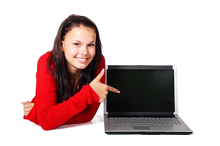 black and gray laptop computer beside girl wearing red long-sleeved shirt