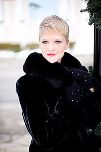 woman in black coat in focus photography