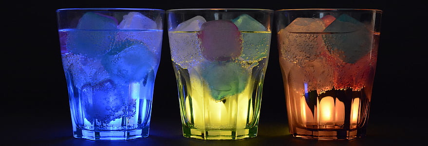 three assorted-color gel candles
