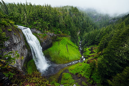 water falls surrounded with mountain range