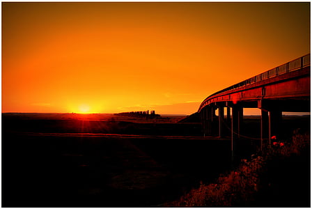 photo of bridge during sunset