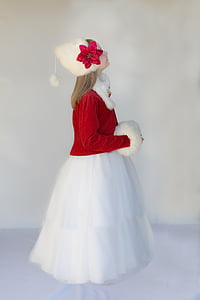 toddler girl in red and white long-sleeved dress