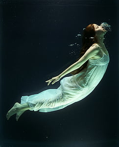woman wearing sleeveless dress while diving