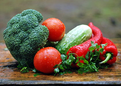 red tomatoes, cucumber, red bell peppers, and broccoli