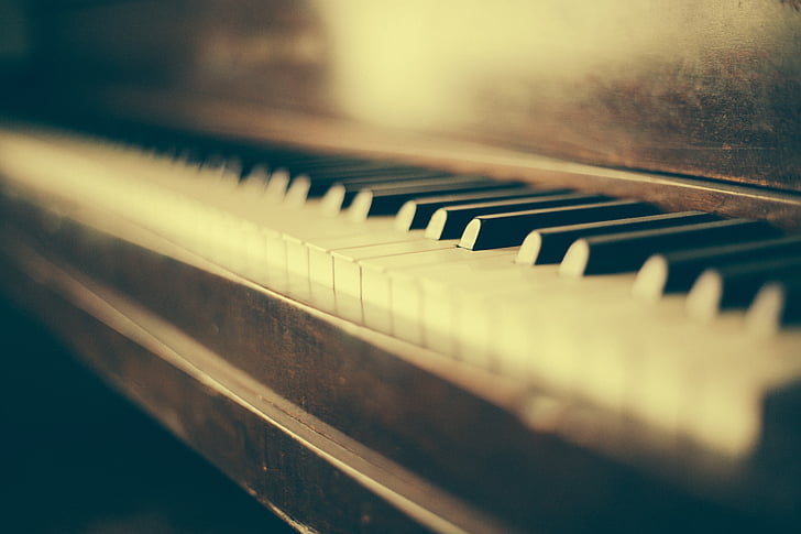 shallow focus photo of black and white piano