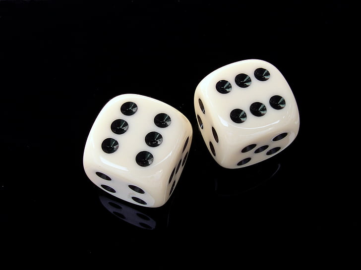 two white-and-black dice cubes