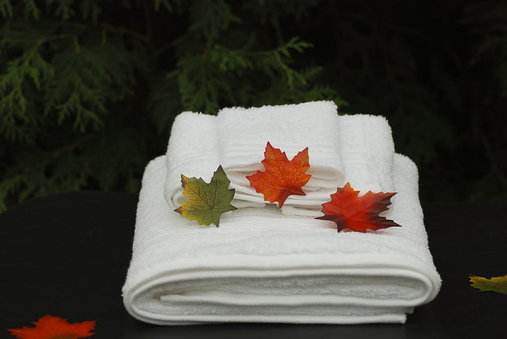 white towels with leaves