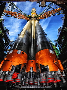 worm's eyeview of orange and white space shuttle