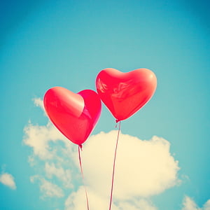 two red heart balloons