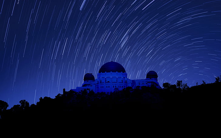 long exposure photography of mosque at night with stars