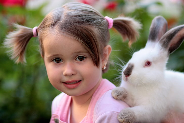 toddler girl wearing pink shirt and white rabbit