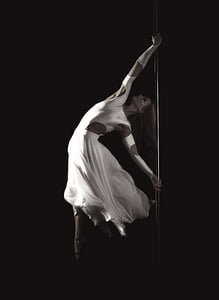grayscale photography of woman pole dancing