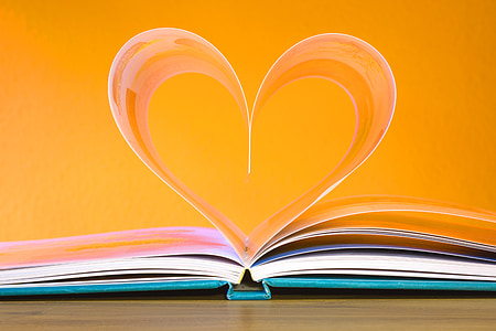 book page form heart in close-up photography
