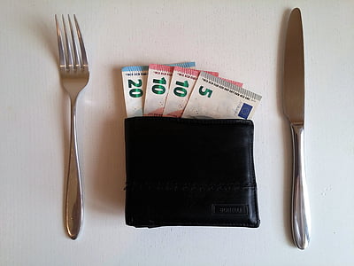 4 banknotes and two silver fork and bread butter knife