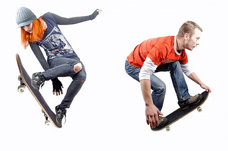 two person performing tricks on skateboards