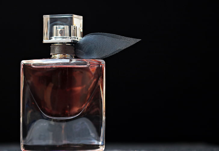 fragrance spray bottle with black background