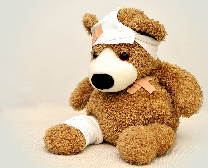 brown injured bear plush toy