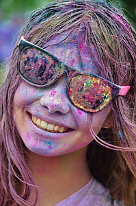 woman with assorted color paints on face