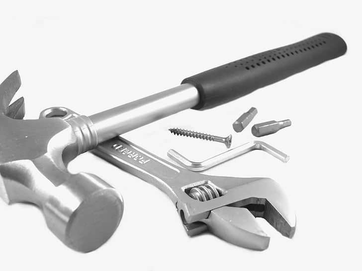 two gray claw hammer and crescent wrench