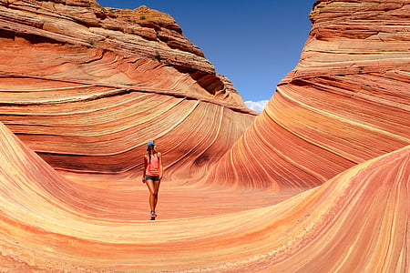 woman standing between brown canyon
