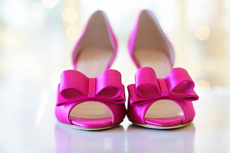 pair of pink leather peep-toe heeled sandals