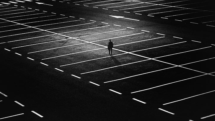 person standing on parking lot