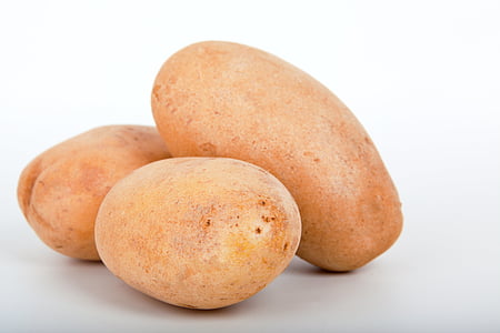 close up photo of three potatoes
