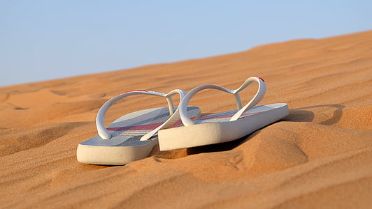 pair of white flip-flops