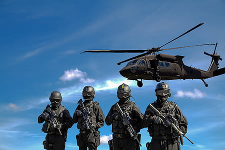 gray helicopter over four soldier
