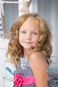 close up photograph of girl in sequin gray with pink ribbon tank dress