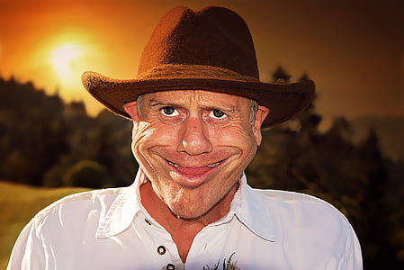 closeup photo of man's white polo shirt and brown cowboy hat