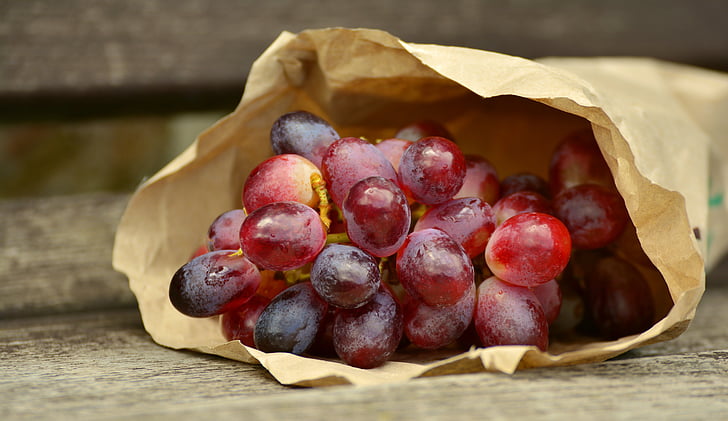 grape fruits in brown paper bag