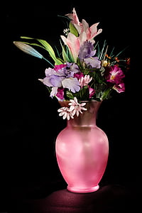 purple and pink flowers in pink vase